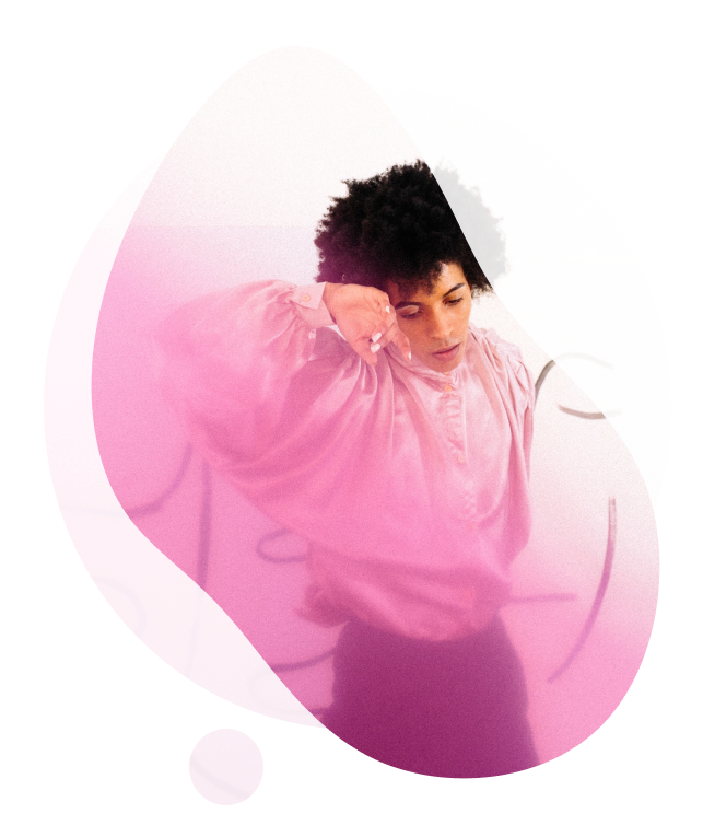 energetic young male dancing in pink illumination