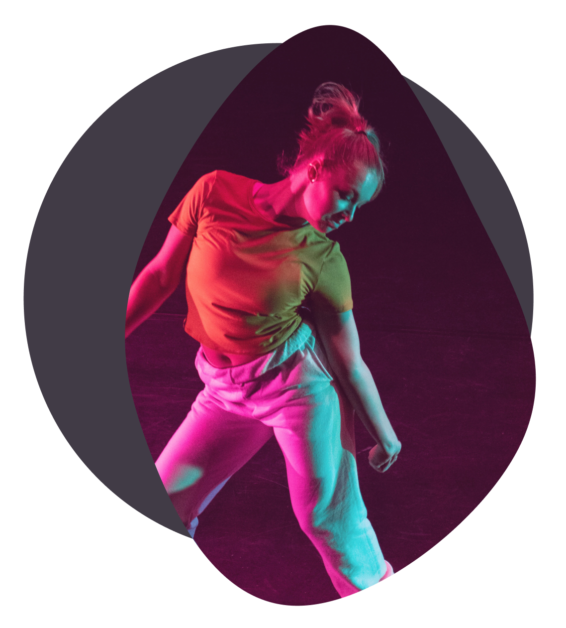 energetic young male dancing in pink illumination